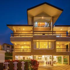 StayVista's Emilia Villa - Terrace with Deck, Outdoor Jacuzzi, Indoor Activities, Garden, and Gym