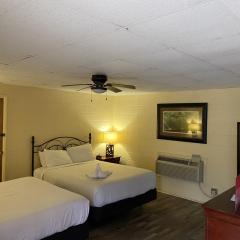 JI9, a Queen Guest Room at the Joplin Inn at entrance to the resort Hotel Room