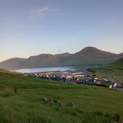 Experience unique Faroe Islands holiday home by the sea with great views, fully equipped kitchen and reliable Wi-Fi