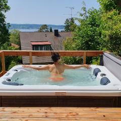 Ferienhaus Wellnesshütte mit Außenwhirlpool und herrlichem See-und Alpenblick