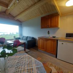 small camping cabbin with shared bathroom and kitchen near by