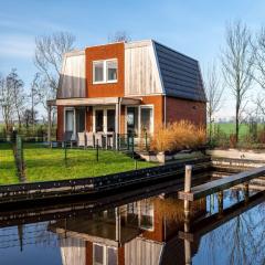 Spacious holiday home with outdoor spa, on a holiday park in Friesland