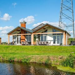 Wellness home located on the water, on a holiday park in Friesland