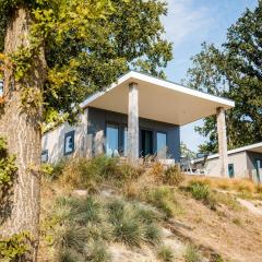 Chalet with a view of the beach or harbour, in a holiday park on the Leukermeer