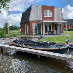 Spacious holiday home with private jetty right on the water