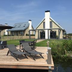 Modern wellness lodge with sunshower in a national park