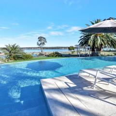 Lake Palm Resort Luxury Retreat absolute Waterfront on 3 acres at Lake Macquarie.