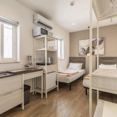 Studio apartment with twin beds & kitchenette at the new Olo living 24