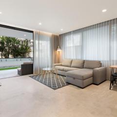 Modern 1BR Abode with Courtyard Steps to the Beach