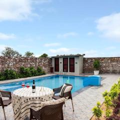 StayVista's La Villa Farm - Tranquil Retreat with Outdoor Pool, Games & Terrace