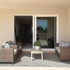 Oceanfront condo with large patio, direct water access, pool, central AC, & W/D