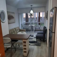 Acogedor Departamento Central con Piscina, Estacionamiento Privado y Más
