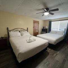 JI7, A Queen Guest Room at the Joplin Inn at entrance to the resort Hotel Room