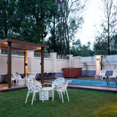 StayVista's Skylight Serenity with Modern Interiors, Outdoor Pool, Poolside Gazebo, Manicured Lawn