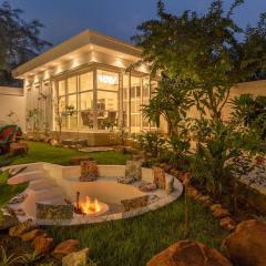 StayVista's Indraj Manor - Roman-Inspired Villa with Posh Interiors, Mesmerizing Garden & Outdoor Fireplace