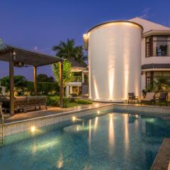 StayVista's The Secret Lagoon with Outdoor Pool, Verdant Lawn & Indoor-Outdoor Activities