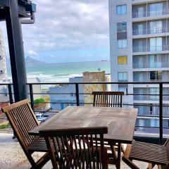Top floor apartment by the beach