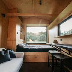 Tiny house in apple orchard