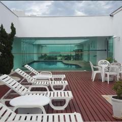 Apartamento pé na areia com piscina aquecida