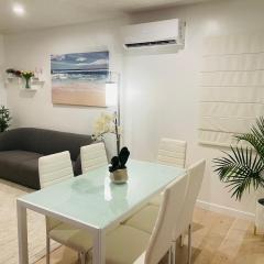 Vacation House 2-Bedroom 1 Bathroom in Beach Town with Full size Kitchen and free onsite parking and laundry - Great for solo, couple, family and business travelers