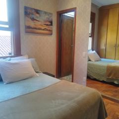 Quarto Suite -Em apartamento familiar