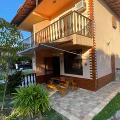 Casa Feliz 2 quartos com Ar, condominio com piscina,200m da lagoa