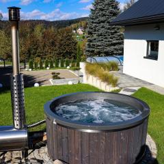 Domek Viking z prywatnym ogrzewanym basenem sauną oraz balią z jacuzzi
