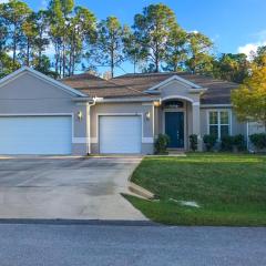 Dog-friendly home with Tesla EV charger, yard, patio, grill, AC, & W/D