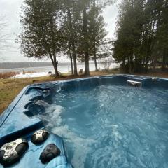 Lovely waterfront private cottage with hot tube