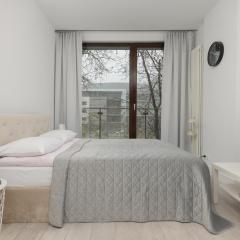 Elegant White Studio with Balcony in Warsaw by Renters