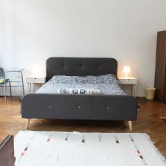 Xxl room with a lounge overlooking Britanski trg, shared bathroom and kitchen