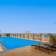 StayVista's Cityscape - Urban Retreat with Terrace, Pool & Lawn