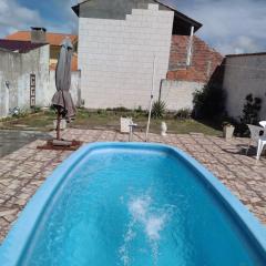 CASA COM PISCINA EM BALNEÁRIO PINHAL RS