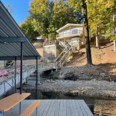 Waterfront on a quiet cove with large dock with lily pad