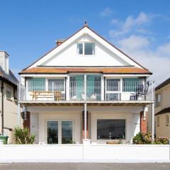 Absolute Beachfront with Decked Garden Oasis and Views