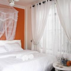 Orange-themed cozy, modern apartment