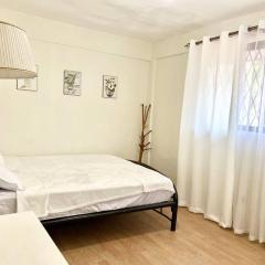 Cozy 2-BR near DLSU-D - Netflix Wi-Fi Parking Garden and Complete Kitchen