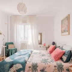 Cozy and Stylish Room with Natural Light and Vibrant Decor