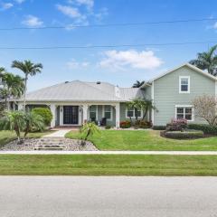 Coastal two-story home on water with pool/dock
