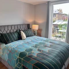 Room with balcony overlooking a garden