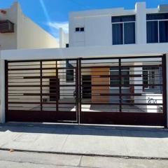 House 5 min by the beach, with wide open garage.