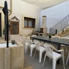 Village house with patio and barbecue