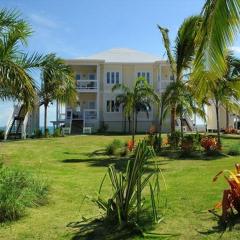 Coastal Haven: Charming Beachfront Cottage with Pool