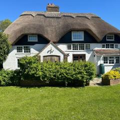 Beautiful Thatched Cottage with Outdoor Pool, Secure Garden, Dog & Family Friendly! Chichester Holiday Properties