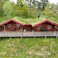 Traditional Norwegian log cabin with sauna by the sea