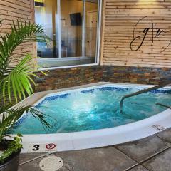 Cozy Villa 3 mins to Mohegan- Fully Stocked with King Bed & Fireplace- Jacuzzi, Saltwater Pools, Sauna