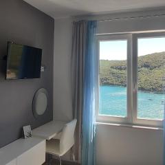 Apartment Noemi with a direct beach view