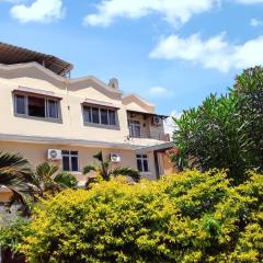 2 bedrooms apartement at Grand Baie 400 m away from the beach with shared pool enclosed garden and wifi