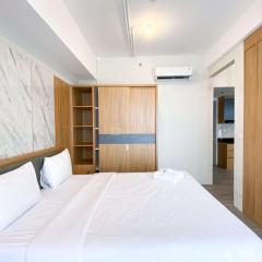 Homey and Spacious Studio Vasanta Innopark Apartment By Travelio