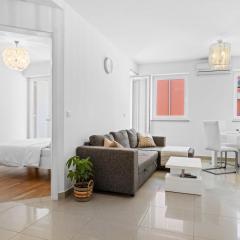 Charming White Apartment with Balcony and Parking